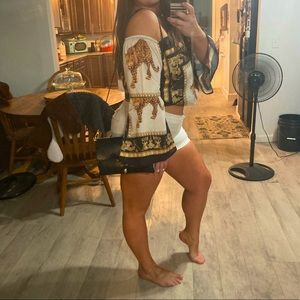 Leopard silk off shoulder blouse. Gives Miami vibes..